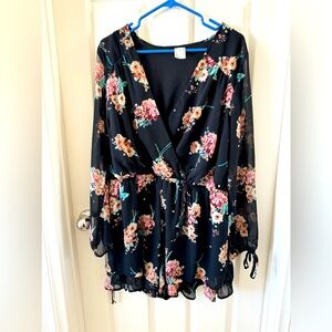 Flower romper with ruffle detail.